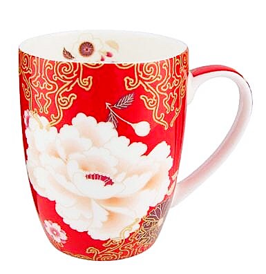 Red mug with white floral design and gold patterns on a white background