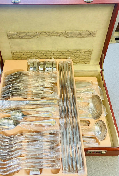 Set of silverware in a case on a table.